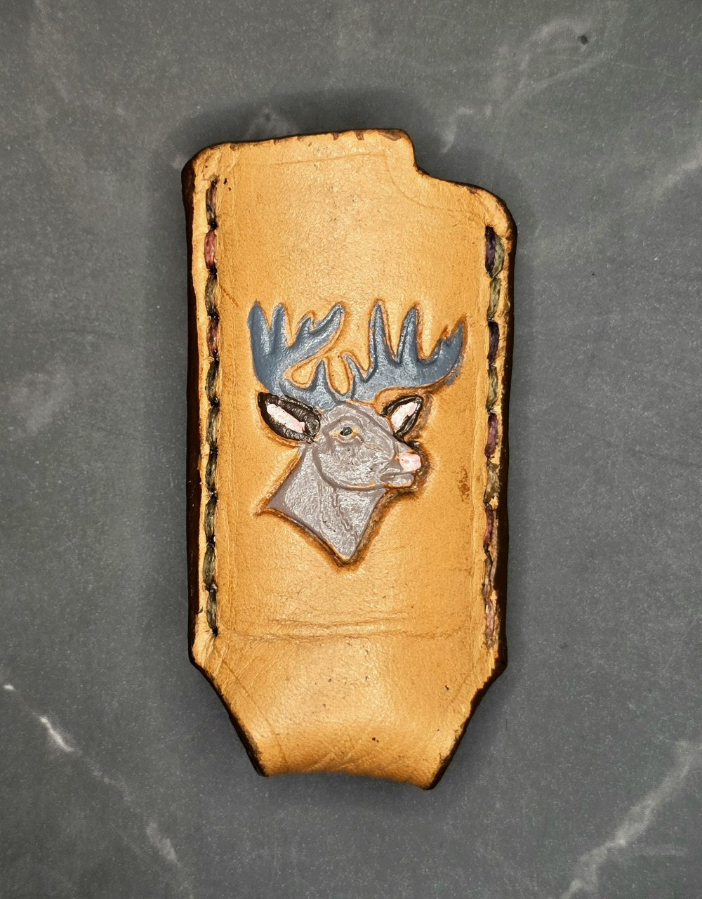 Veg-tan leather lighter case for bic lighters with a hand-painted deer picture.