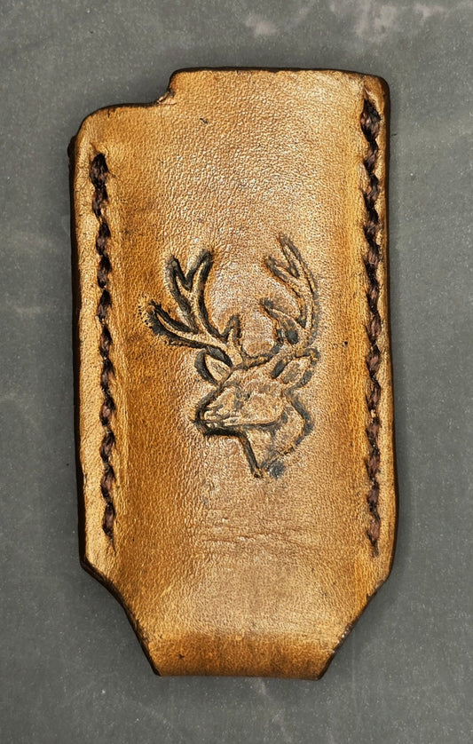 Veg-tan leather lighter case for bic lighters with a picture of a deer stamped into it.