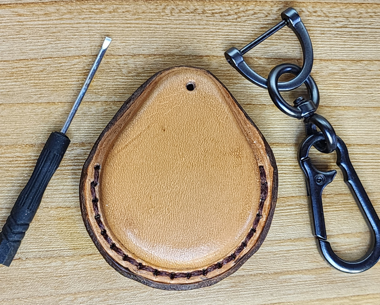 Back view of leather fob case for Harley Davidson motorcycles with mini screwdriver and keychain