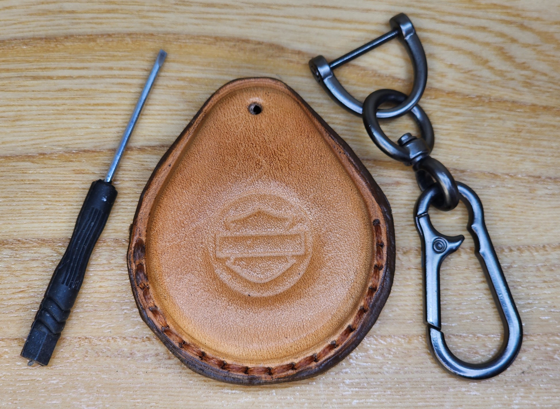 Front view of veg  tanned leather harley davidson motorcycle key fob case with keychain and mini screwdriver