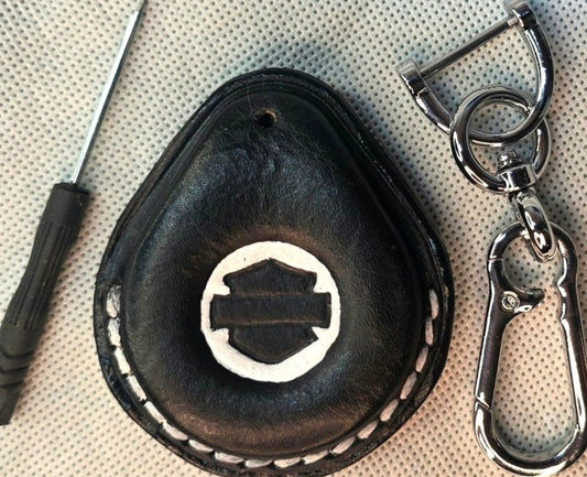 Black veg-tan leather key fob case for Harley Davidson motorcycles with white stitching.