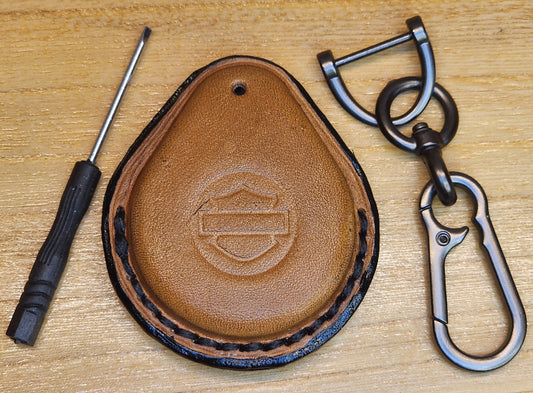 Brown/tan colored Veg-tan leather key fob case for Harley motorcycles with lobster clasp keychain and screwdriver.