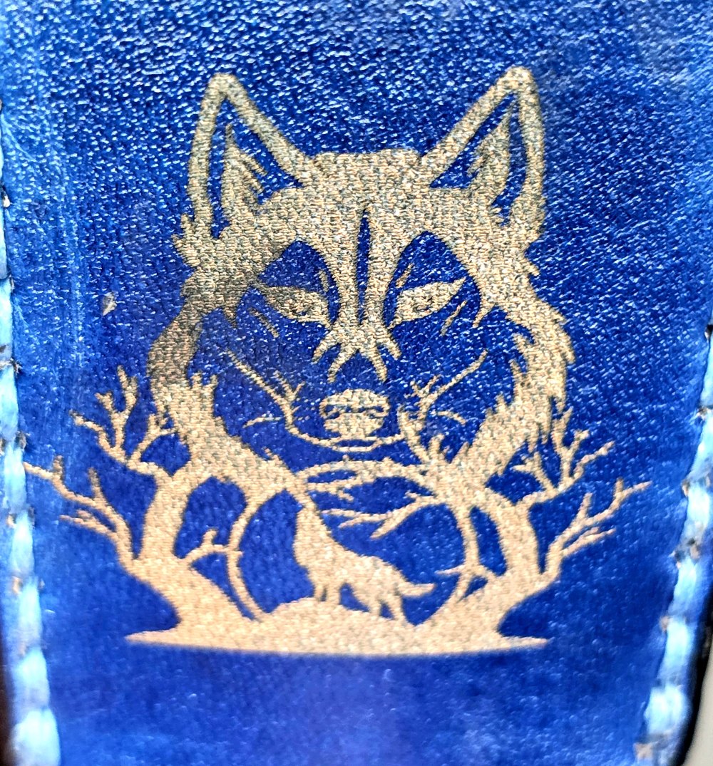 Navy blue veg-tan leather Bic lighter case with a hummingbird laser engraved into it created by JnRcreativeCrafts.