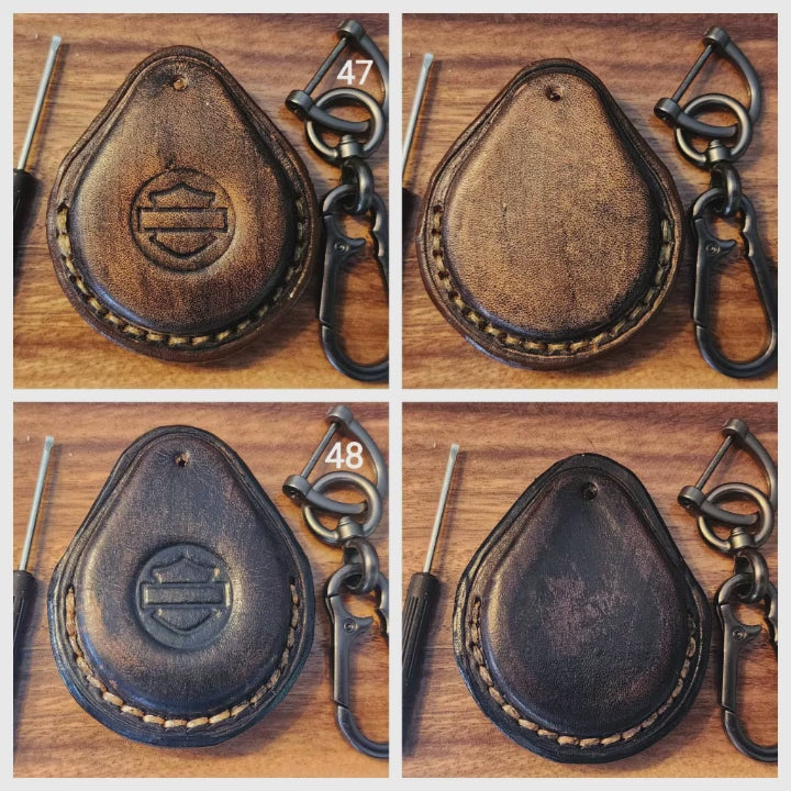 Showing leather harley davidson key fob cases in a variety of colors with harley davidson logo