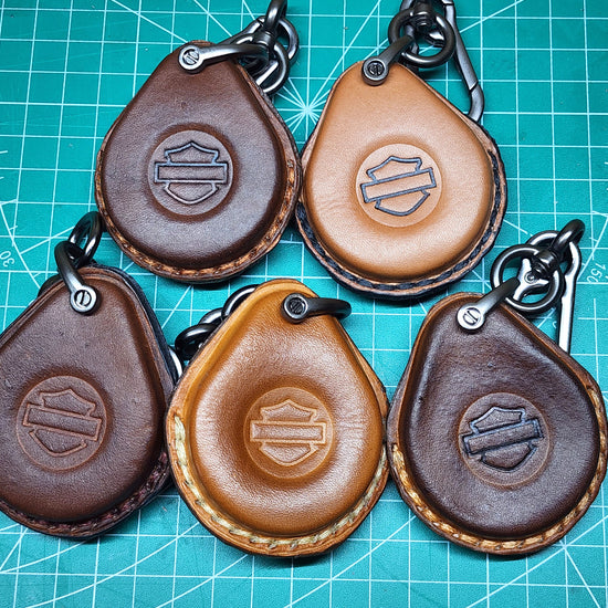 Video showing our freshly wet molded veg-tanned leather key fob cases drying before and after being dyed.