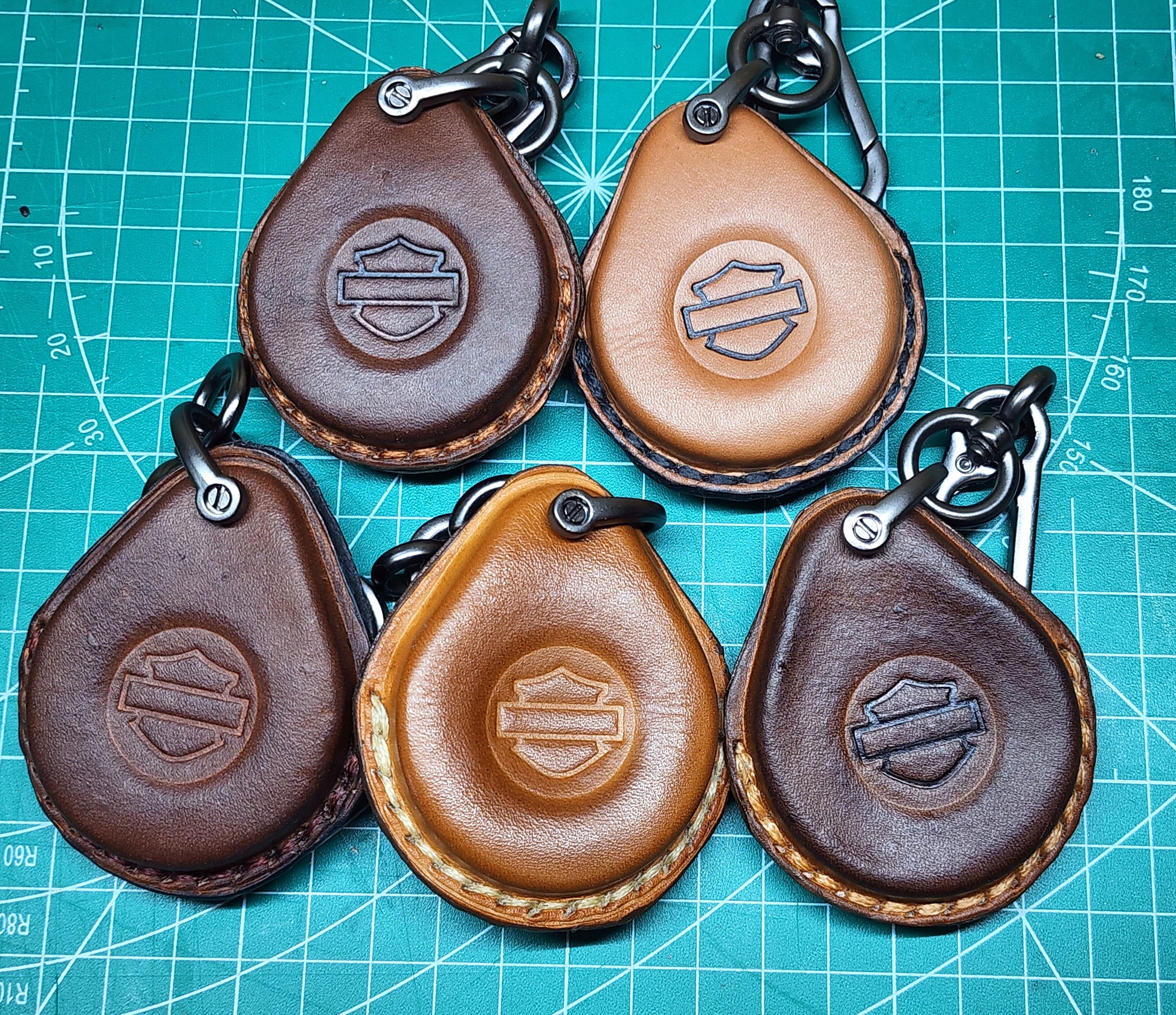 Video showing production of leather harley davidson key fob cases in different  colors